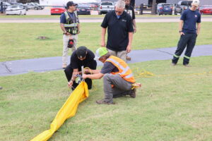 Participants Learning How to Connect the End of the Boom to Anchoring Rope