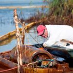 Oil drum skimmer cleaning up thick oil spill