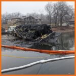 12" fastwater river and creek boom deployed around a boat that had caught fire and then sunk