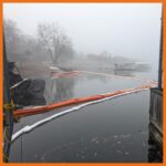 12" fastwater river and creek boom deployed around an area to prevent oil from getting into boat slips