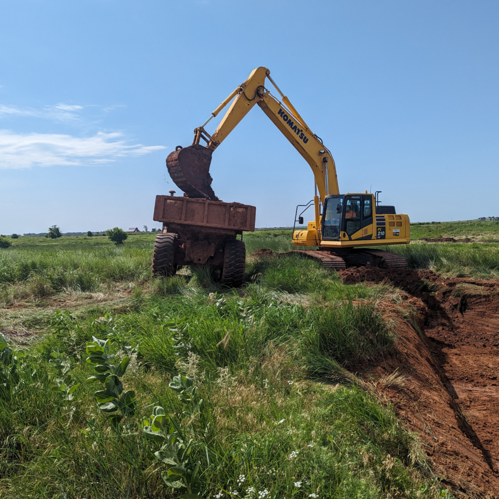 A picture of a dump truck ready to haul off contaminated soil