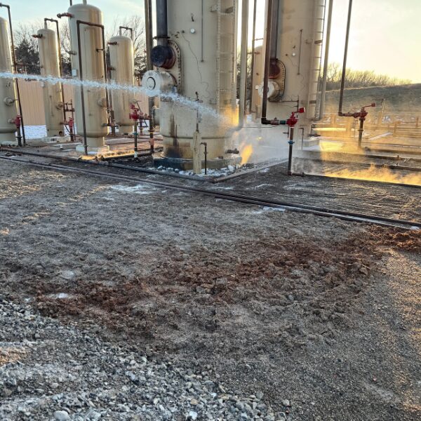 Our proprietary chemical mix being applied to oil contaminated soil
