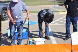Boom School Participant Learning About the Different Tools for Proper Decontamination