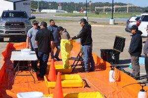 Participants Going Through Decontamination Site to Learn the Logistics