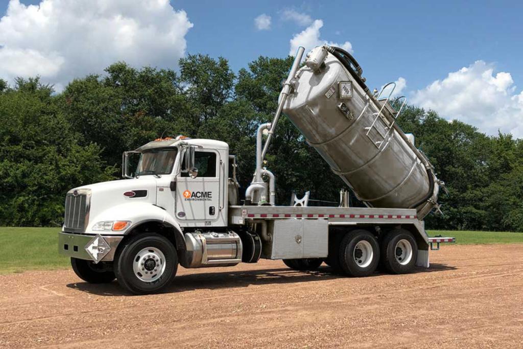 ACME Environmental's vacuum truck showcasing its' hydraulically powered tank