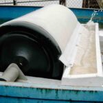 Oil drum skimmer cleaning up thick oil spill