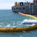 Oil Disc Skimmer in action cleaning up an oil spill