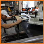 Perma-Boom Holes Being Punched for Floats