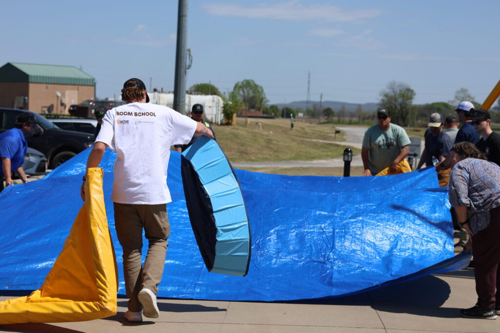 Students learning how to set up a decontamination site after an oil spill response