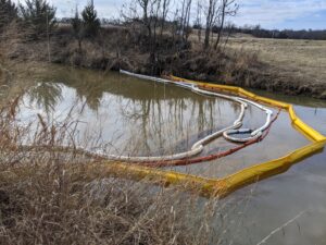 Containment Boom and Absorbent Boom deployed to prevent the further spread of oil