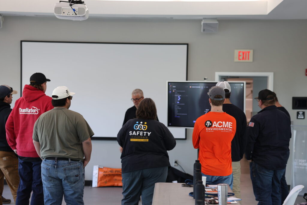 Students learning ACME's digital dashboard at Boom School