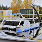 Oil disc skimmer cleaning up thick oil spill