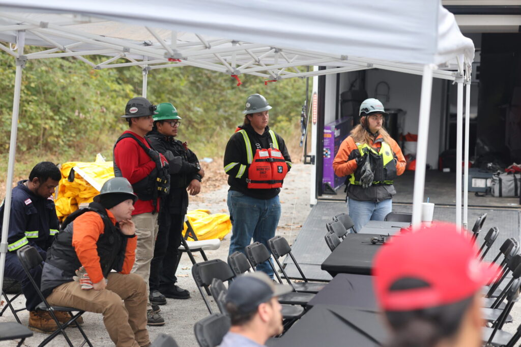 Boom School participants being briefed of operations for the training
