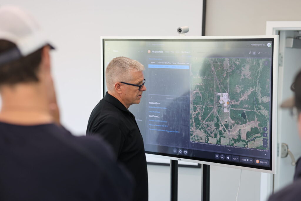Students learning ACME's digital dashboard at Boom School