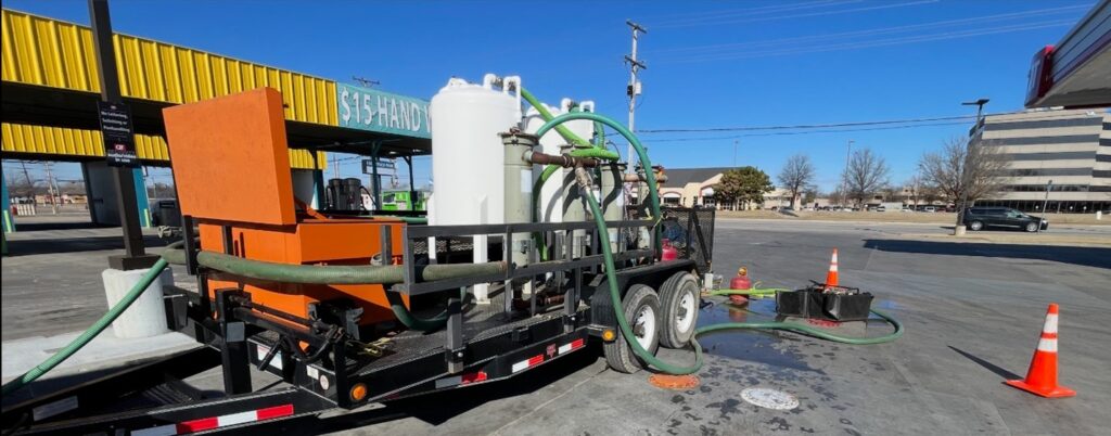 ACME's GAC Trailer cleaning out underground storage tanks at a gas station