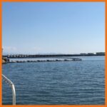 Inflatable containment boom deployed in open waters