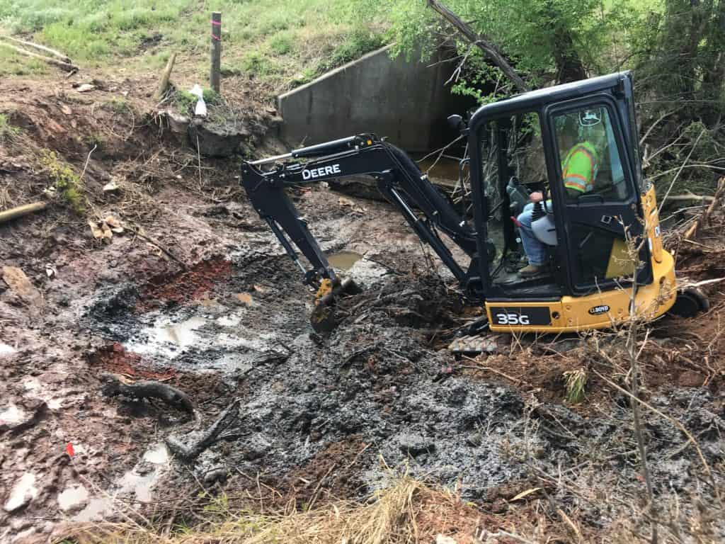 A picture of an excavator being used to remove large amounts of oil contaminated soil